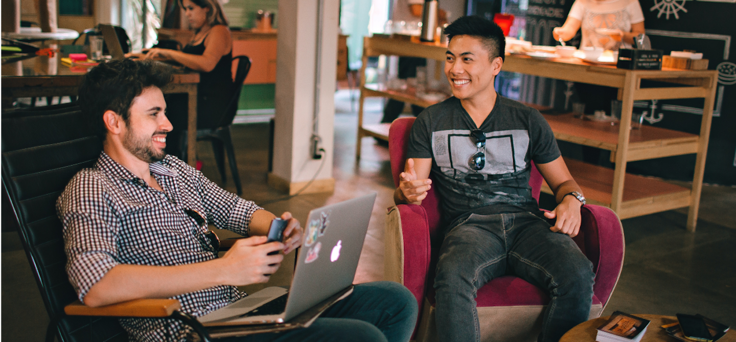 two people discussing in an office environment